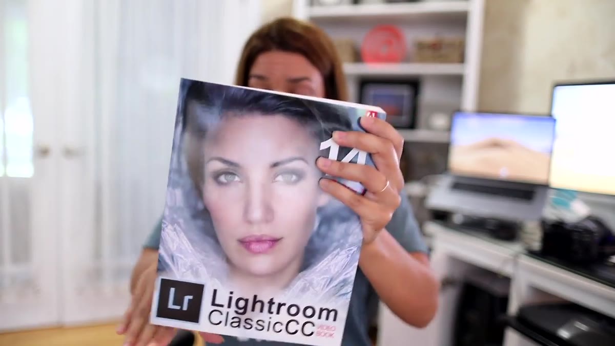 Chelsea showing the Lightroom CC book cover and companion video content
