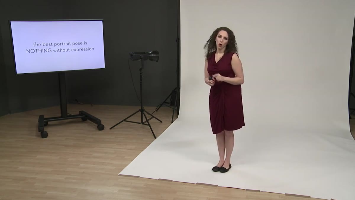 Instructor explaining that expression elevates an otherwise average portrait