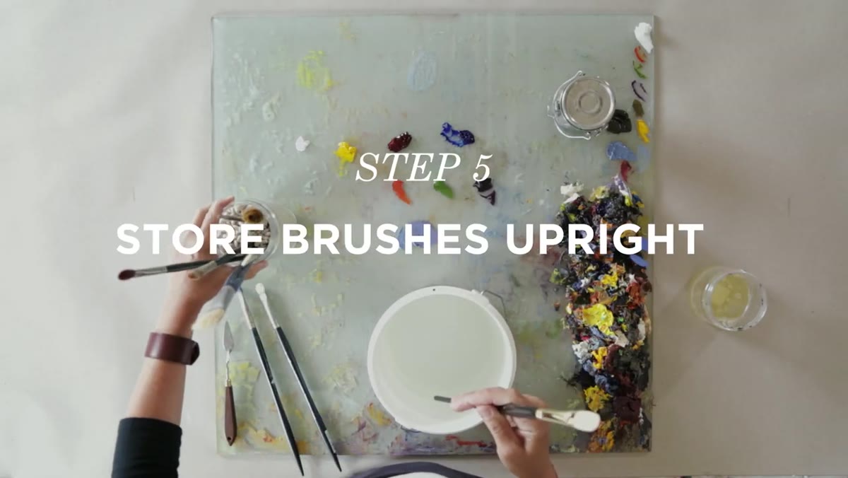 Clean brush stored upright in jar of dried white beans