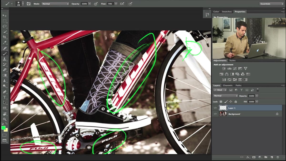 Aaron pointing out multiple logo locations on the bicycle