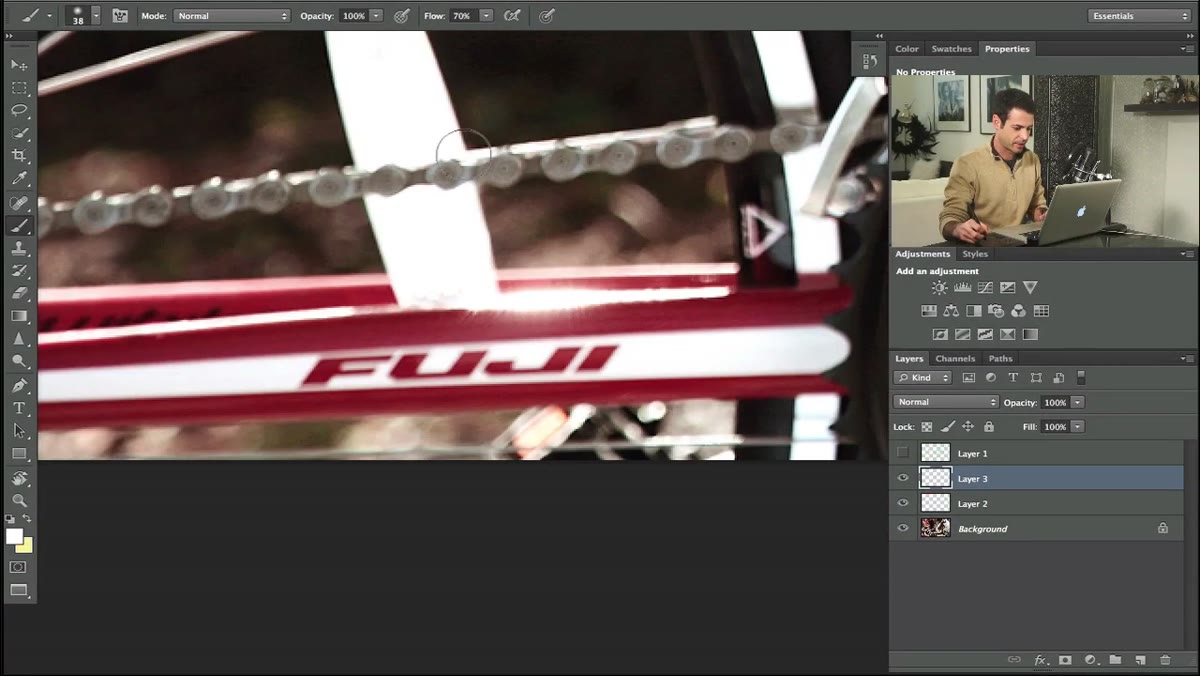 Drawing a polygonal lasso selection around a logo on the bike frame