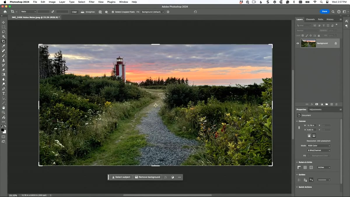 Crop tool active with straighten tool dragged along horizon line