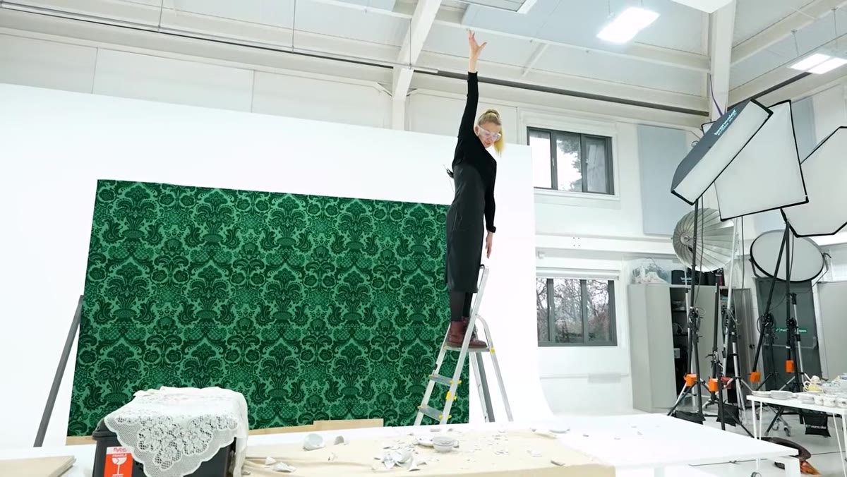 Team member climbing taller ladder to increase drop height