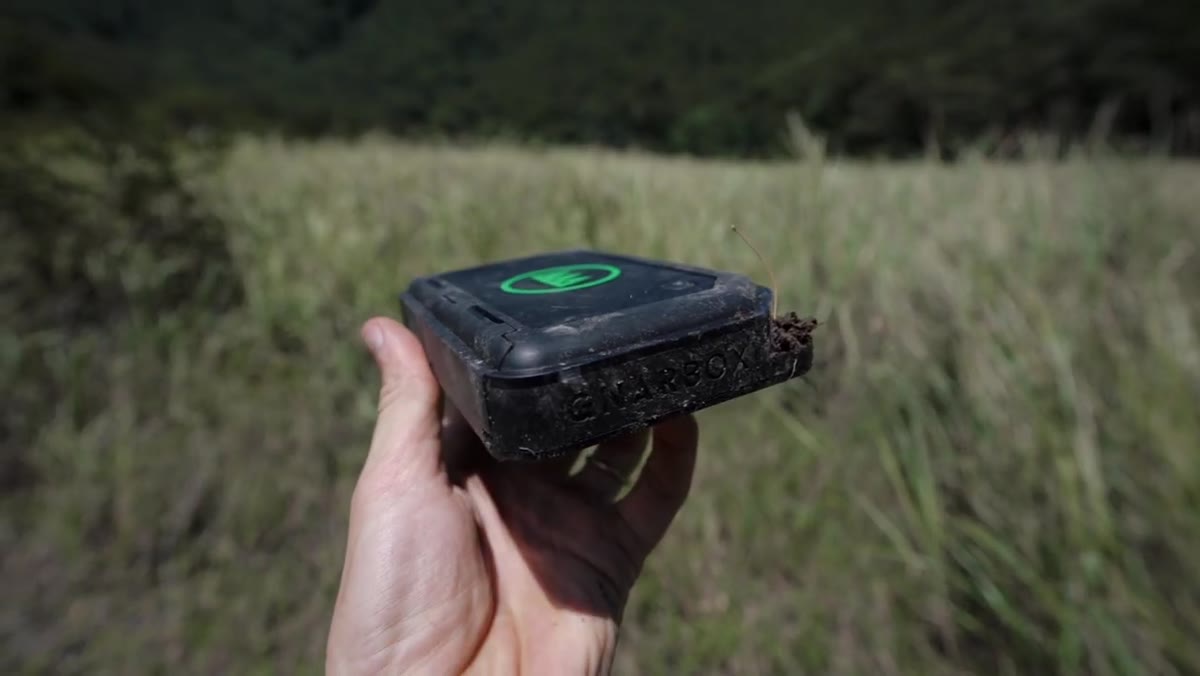Pierre showing the portable Gnarbox field backup device