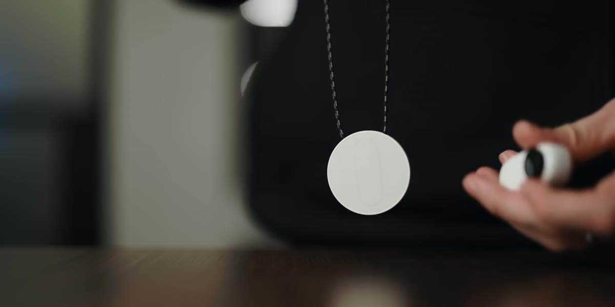 McKinnon demonstrates the magnetic pendant worn under a shirt