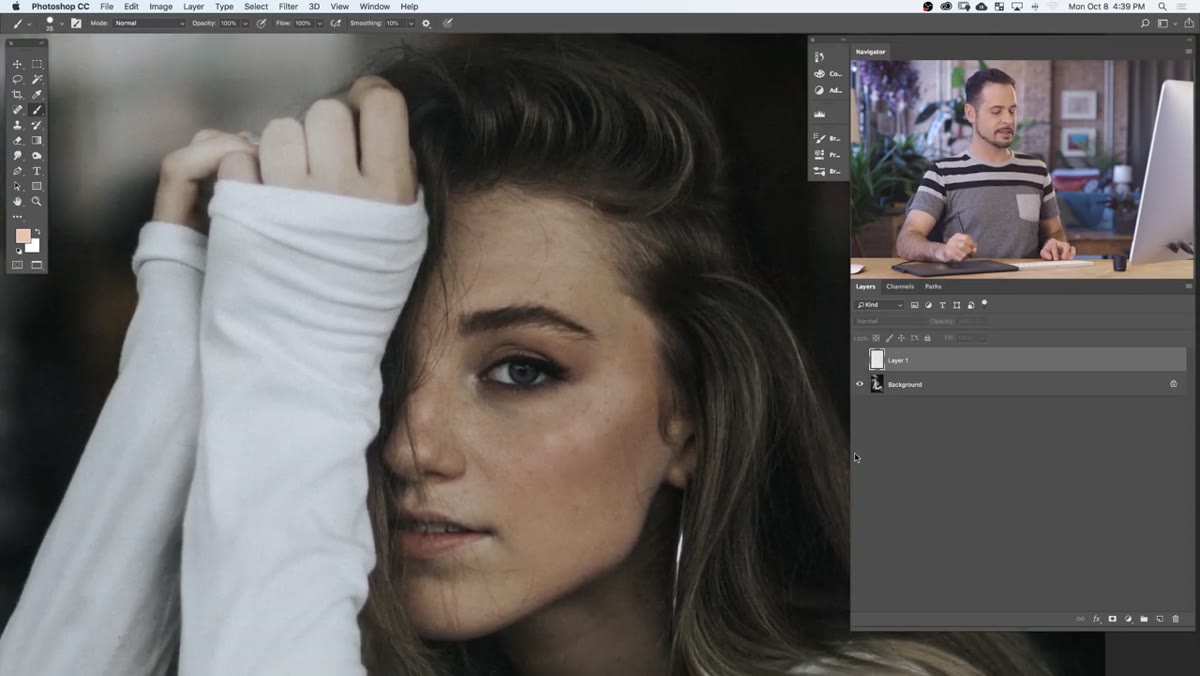 Uneven highlight visible on subject&rsquo;s forehead before correction